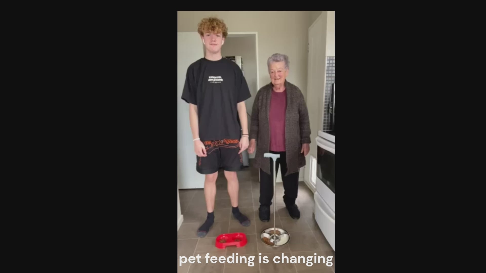 Load video: &quot;Video demonstration of the Flexi Pet Feeder with long handle showing how to feed a dog or cat without bending down — ideal for seniors, disabled pet owners, or people with back pain.&quot;